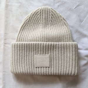 NWOT Acne Studios cream beige face logo beanie